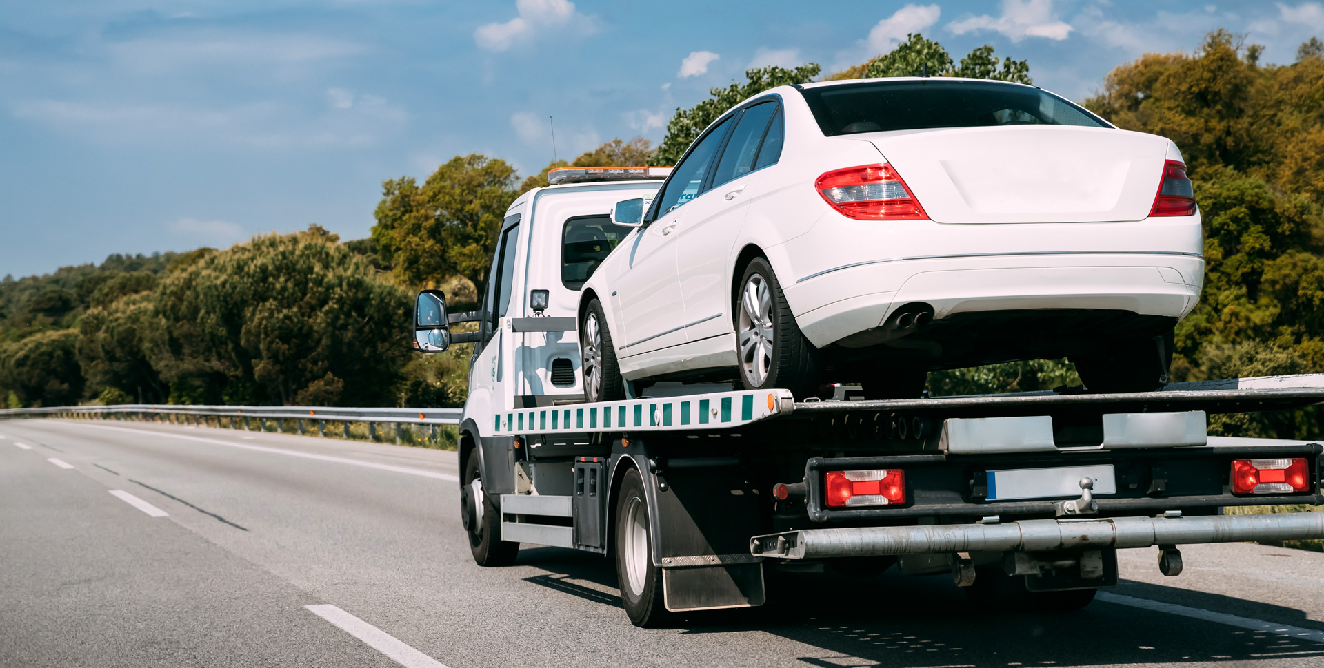 Car on Flatbed Tow Truck